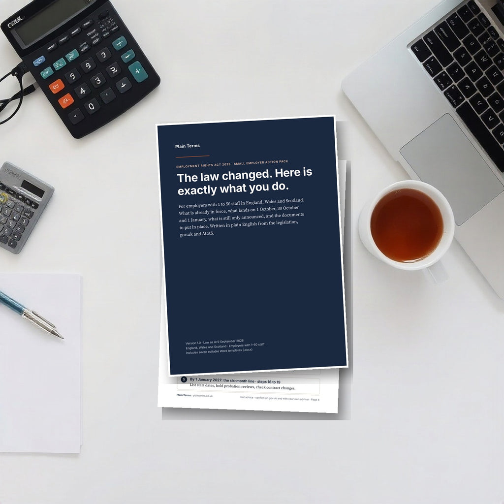 The Employment Rights Act employer pack printed on an office desk beside a laptop and calculator